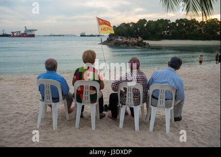 Singapore, Republic of Singapore, Asia, Tourists at Siloso Beach on Sentosa Stock Photo