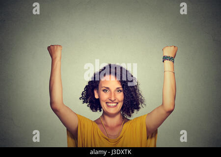 Successful woman with arms up celebrating Stock Photo
