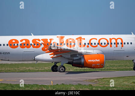 Easyjet commercial passenger Airbus A 320-214 aircraft in its unmistakeable company orange livery Stock Photo