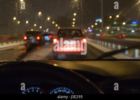 Driving a car in a bad weather, in traffic jam Stock Photo