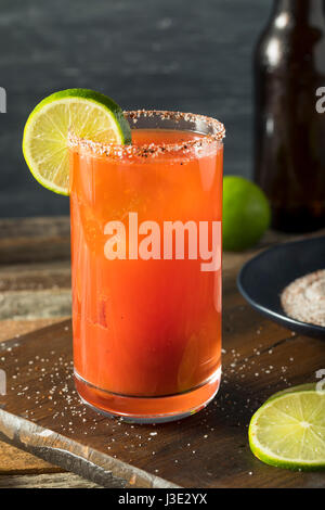 Homemade Michelada with Beer Salted Rim and Tomato Juice Stock Photo