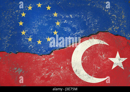 Turkish Flag and European Union Flag painted on old cracked wall Stock Photo
