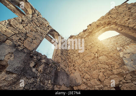 Scenic view of the ruined cloister of an abandoned monastery. Stock Photo