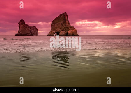 Archway Islands on the beach at Wharariki Beach near Nelson, New Zealand Stock Photo