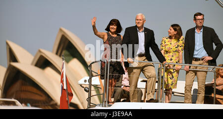 U.S. Vice President Mike Pence, center, wife Karen Pence, left, sail past the iconic Opera House accompanied by New South Wales Premier Gladys Berejiklian, center, and NSW Treasurer Dominic Perrottet, right, during a tour of the harbor April 23, 2017 in Sydney, Australia. Australia is the final stop in the Vice President four nation trip to Asia. Stock Photo