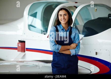 Female Aircraft Engineer Smiling Stock Photo