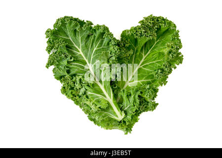 closeup of some leaves of kale forming a heart on a white background Stock Photo