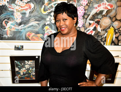 A lady, business woman and actress poses and smiles Stock Photo