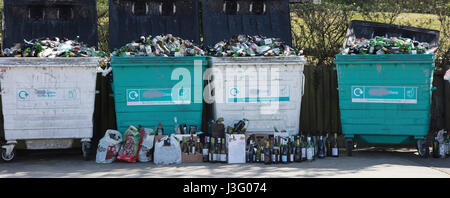 Over flowing bottle recycling bank Stock Photo