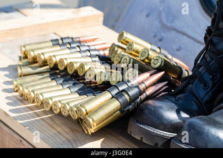 World war two circa Machine gun Canon shells laying next to boot. Stock Photo