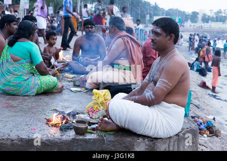 Rameswaram, Tamil Nadu, India - May 25, 2014. Full report about Rameswaram pilgrimage, religion. Religious city rituals. Priest on the beach side, off Stock Photo