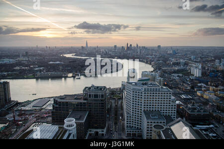 London, England, February 27, 2015: The River Thames meanders through the cityscape of East London as seen from the Docklands Canary Wharf Tower. Stock Photo
