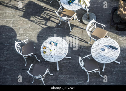 White metal round table and chairs at the pool area of a hotel Stock Photo