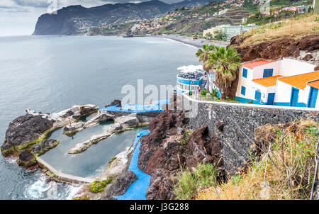 Open air lido carved into the rocks and beach, Funchal, Madeira. Stock Photo