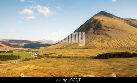 The distinctive mountain of Beinn Dorain looming over Glen Orchy and the West Highland Line railway in Scotland. Stock Photo