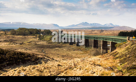 Rannoch Viaduct where the West Highland Railway Line crosses the vast, desolate peat bog landscape of Rannoch Moor in the Highlands of Scotland. Stock Photo