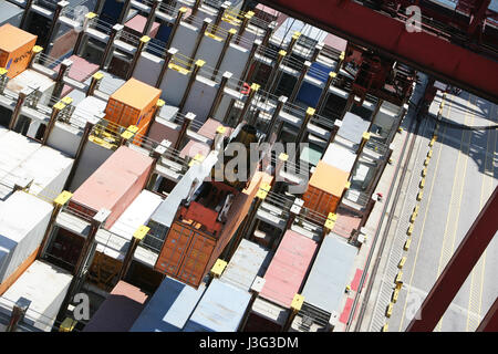 Containers stacked on a ship ready to be transported. Stock Photo