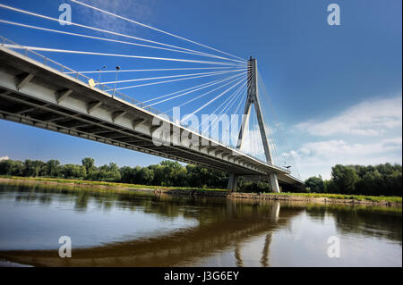 Modern Swietokrzyski bridge in Warsaw over Vistula river, Poland Stock Photo