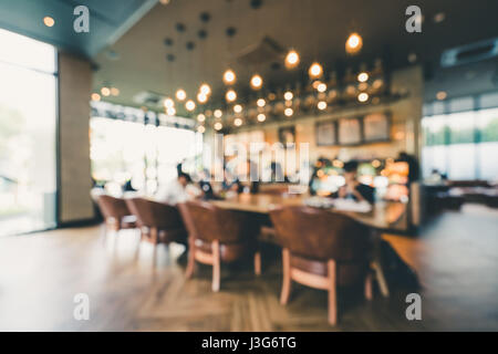 Blur background of modern coffee shop or indoor cafe. Casual lifestyle concept or graphic resource Stock Photo
