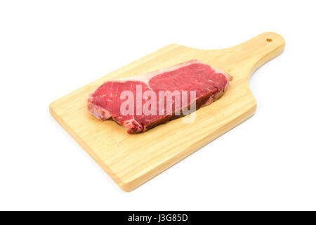 raw beef striploin steak on cutting board isolated on white background Stock Photo