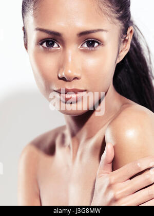 License and prints at MaximImages.com - Natural beauty portrait of a young mixed race asian woman with an exotic look woman on white background