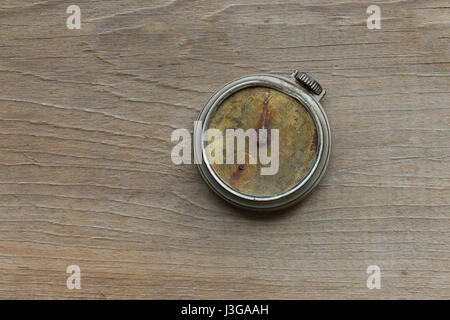 A broken antique pocket watch Stock Photo