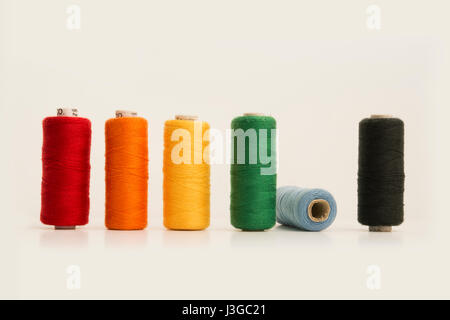 Multi color Sewing Threads, Bobbins, Isolated on White Background. Stock Photo