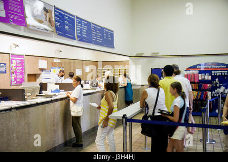 Miami Beach Florida,USPS United States Postal Service post office inside interior,counter customers US mail line queue wait waiting, Stock Photo