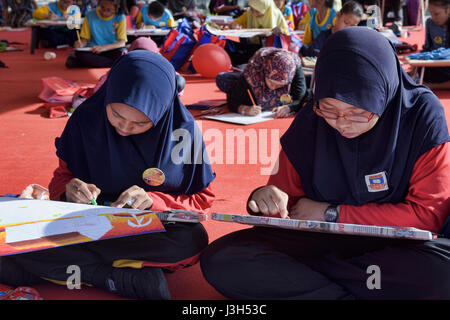 Girls drawing artwork, Malacca, Malaysia Stock Photo