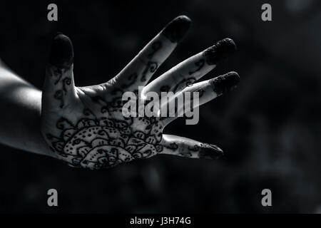 A girl showing his hand decorated with ;Hanna' Stock Photo