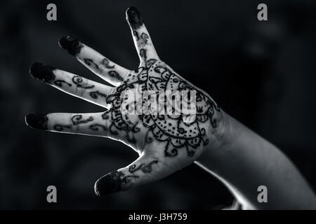 A girl showing his hand decorated with ;Hanna' Stock Photo