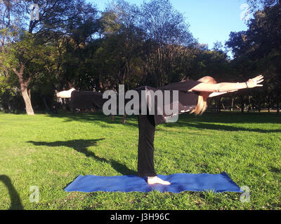 SPAIN, SEVILLE: Claudia is a professional yoga teacher, currently teaching outdoor yoga classes in Seville. Stock Photo