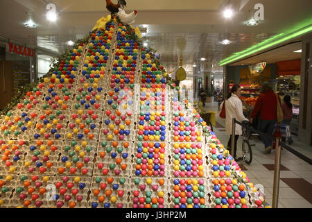 Germany, Cologne, pyramid with colored Easter eggs in a shopping mall. Stock Photo