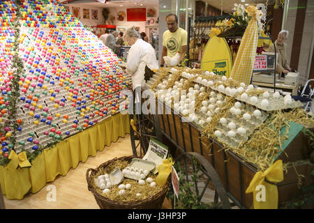 Germany, Cologne, pyramid with colored Easter eggs in a shopping mall. Stock Photo
