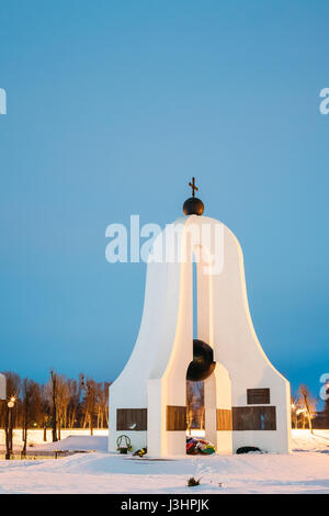 Memorial complex 'Memory' in memory of fallen in the Great Patriotic War in night illumination lights. Dobrush, Gomel region, Belarus. Winter Evening. Stock Photo