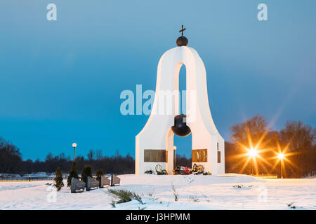 Memorial complex 'Memory' in memory of fallen in the Great Patriotic War in night illumination lights. Dobrush, Gomel region, Belarus. Winter Evening. Stock Photo