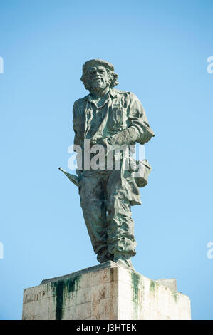 SANTA CLARA, CUBA - JUNE, 2011: Statue of Cuban revolutionary Che Guevara stands in blue sky at a mausoleum dedicated to him and other fighters. Stock Photo