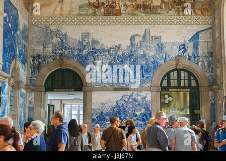 Porto train station, view of the entrance hall inside Sao Bento train station decorated with blue azulejo tiles depicting historical scenes, Portugal Stock Photo