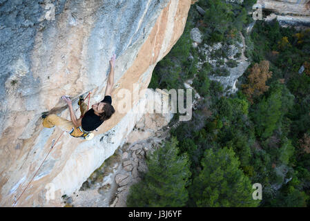 Extreme sport climbing. Rock climber struggle for success. Outdoor lifestyle. A person trying hard to reach sucsess. Spain, Siurana Stock Photo