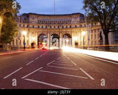 Admiralty Arch, nr. Trafalgar Square, London at night with traffic light trail Stock Photo