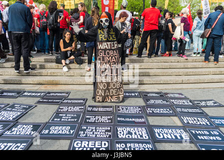 New York, NY 1 May 2017 - A Toxic Harbinger of Death, the Grim reaper, overlooks various demands and socialist issues at a May Day rally for International Workers Day in Union Square Park. ©Stacy Walsh Rosenstock/Alamy Stock Photo