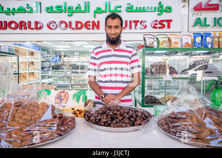 Vegetable market Abu Dhabi - Vegetable market Abu Dhabi - United Arab Emirates - Man selling dates in market Stock Photo