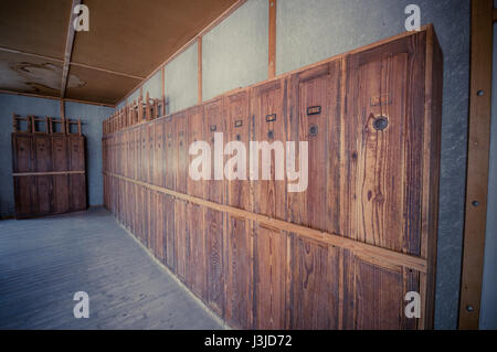 Dachau, Germany - July 30, 2015: Personal lockers inside barracks for prisoners to store private belongings, still in its original state. Stock Photo