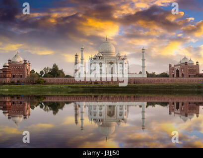 Taj Mahal sunset view from the banks of Yamuna river. Taj Mahal is a white marble mausoleum designated as a UNESCO World heritage site Stock Photo