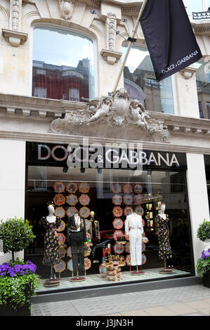 Exterior view of Dolce & Gabbana designer fashion store window display in Old Bond Street London  UK KATHY DEWITT Stock Photo