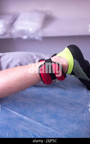 Physical therapy mecical clinic physiotherapy treatment for knee injury and rehabilitation after surgery. Stock Photo