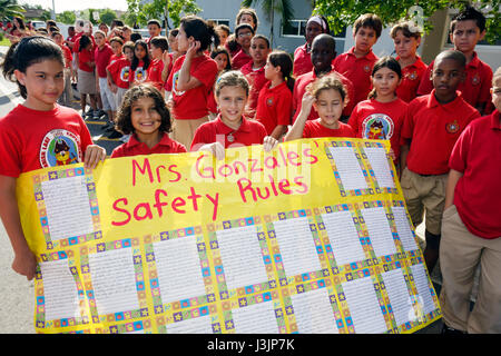 Miami Florida,Spanish Lake Elementary School,International Walk to School Day,student students pupil safety poster contest,parade,Hispanic girl girls, Stock Photo