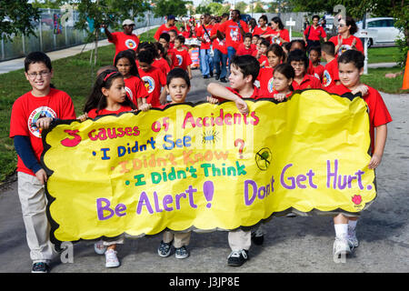 Miami Florida,Spanish Lake Elementary School,International Walk to School Day,student students pupil safety poster contest,parade,Hispanic boy boys,ma Stock Photo