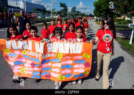 Miami Florida,Spanish Lake Elementary School,International Walk to School Day,student students pupil safety poster contest,parade,Hispanic boy boys,ma Stock Photo