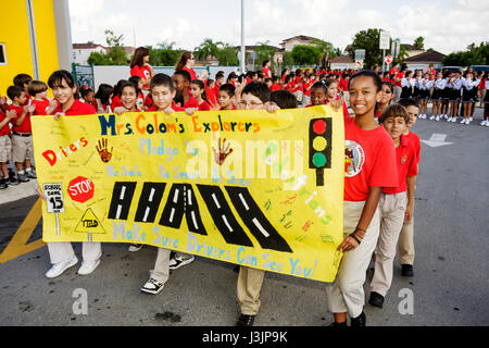 Miami Florida,Spanish Lake Elementary School,International Walk to School Day,student students pupil safety poster contest,parade,Hispanic Black Afric Stock Photo